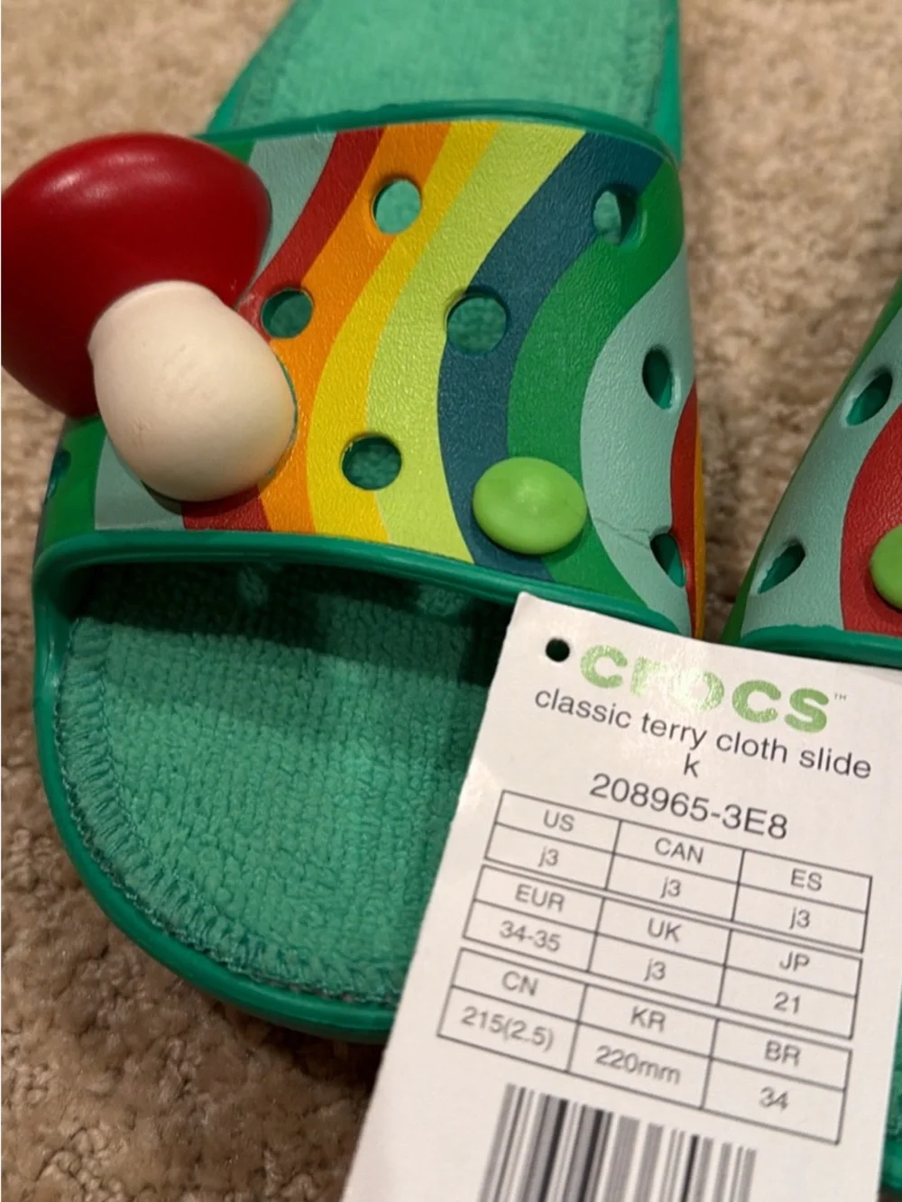 CROCS Kids Teal Slide Sandals with Rainbow Stripes